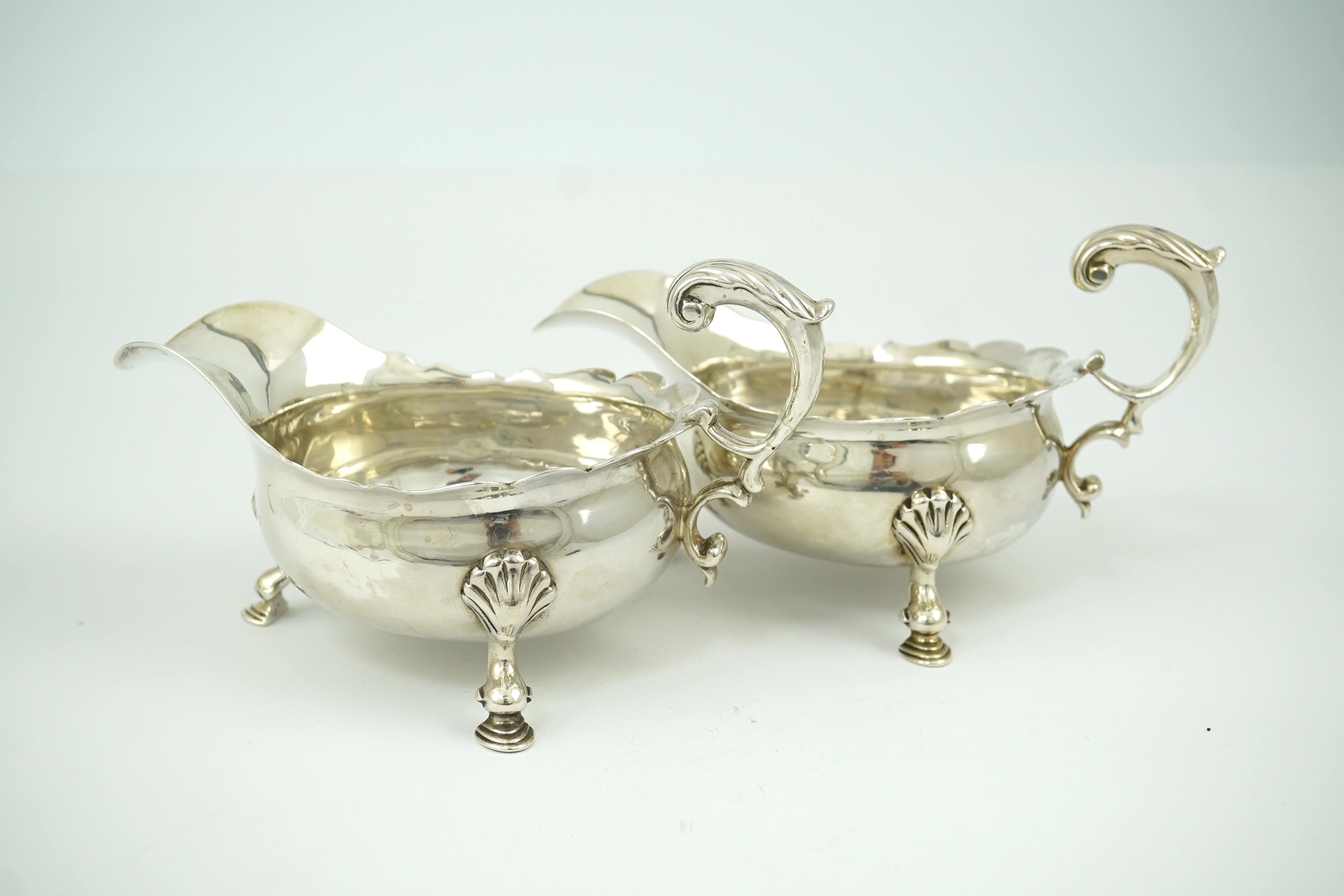 A pair of George II silver sauceboats, by Henry Brind